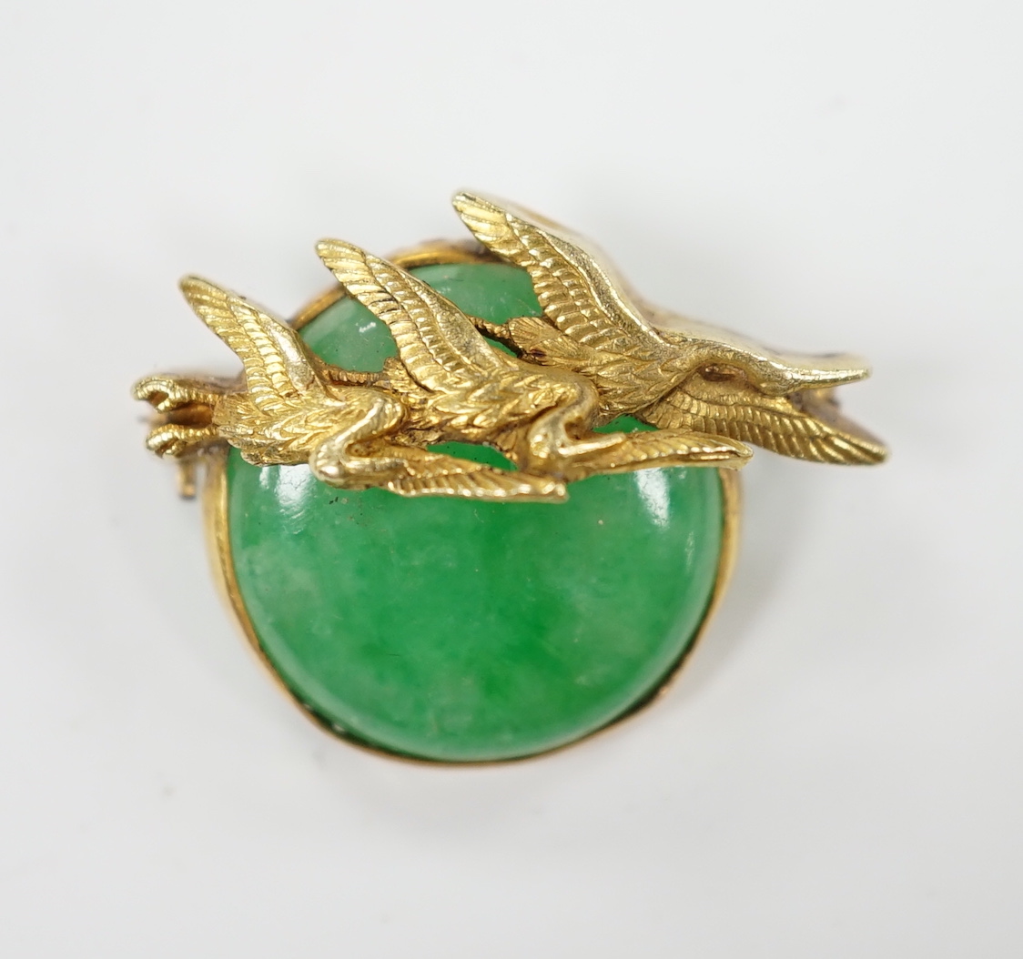 A Chinese? yellow metal mounted jade brooch, the mount with three birds, 29mm, gross weight 7.6 grams.